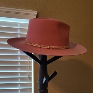 Pink flat brim hat with jewels. One size and adjustable inside the brim.